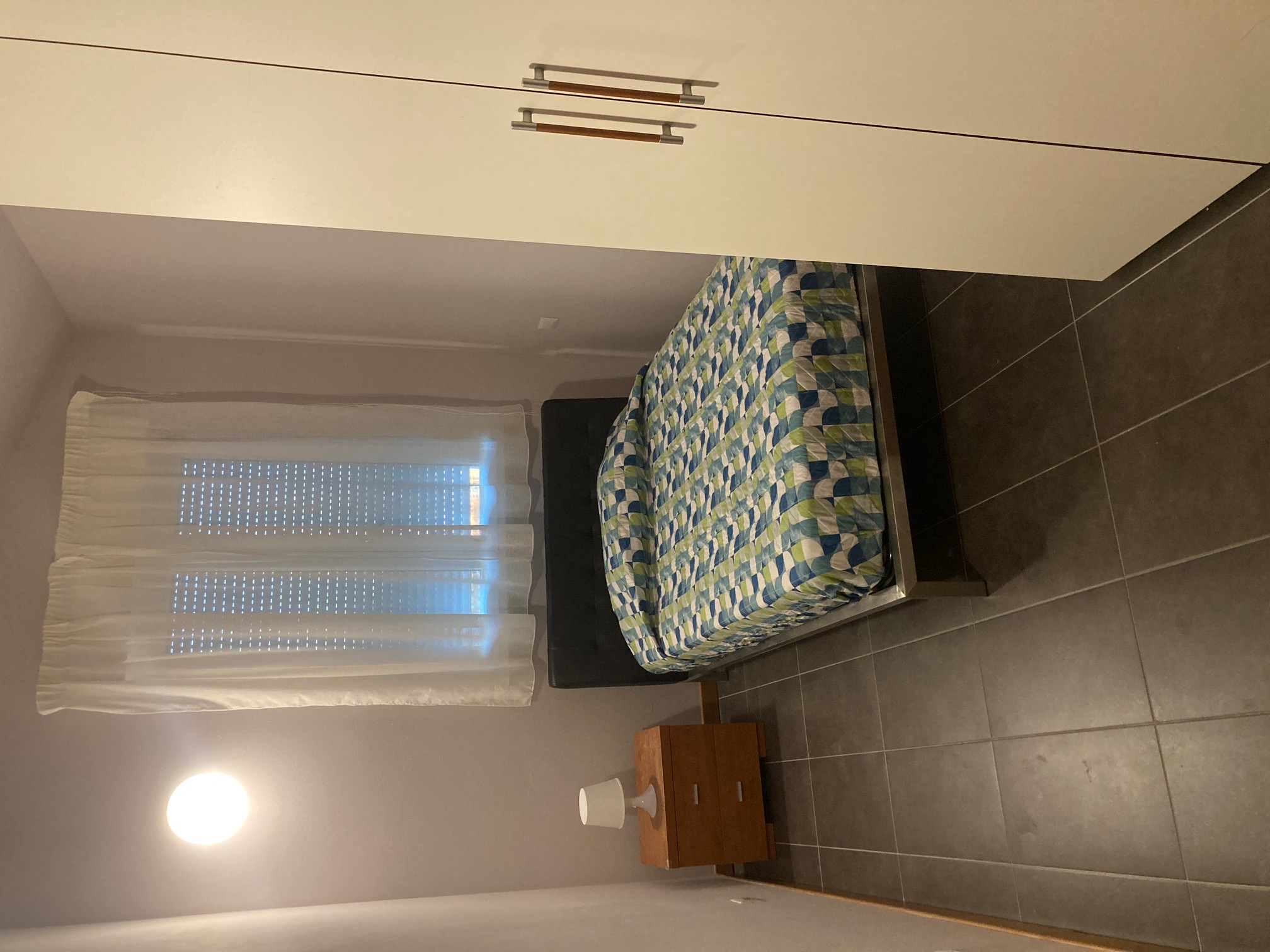Bedroom with bed and wardrobe